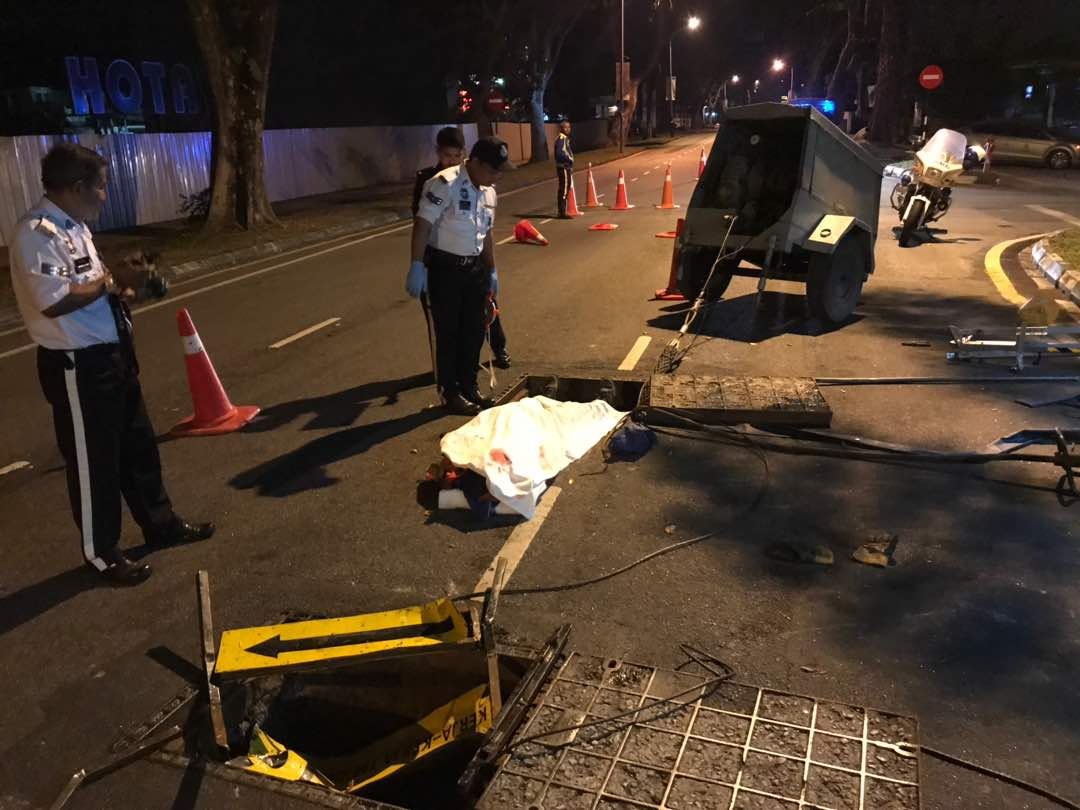 马电讯承包商凌晨在路中央的地下洞进行维修工作时，遭路过的轿车司机撞死。