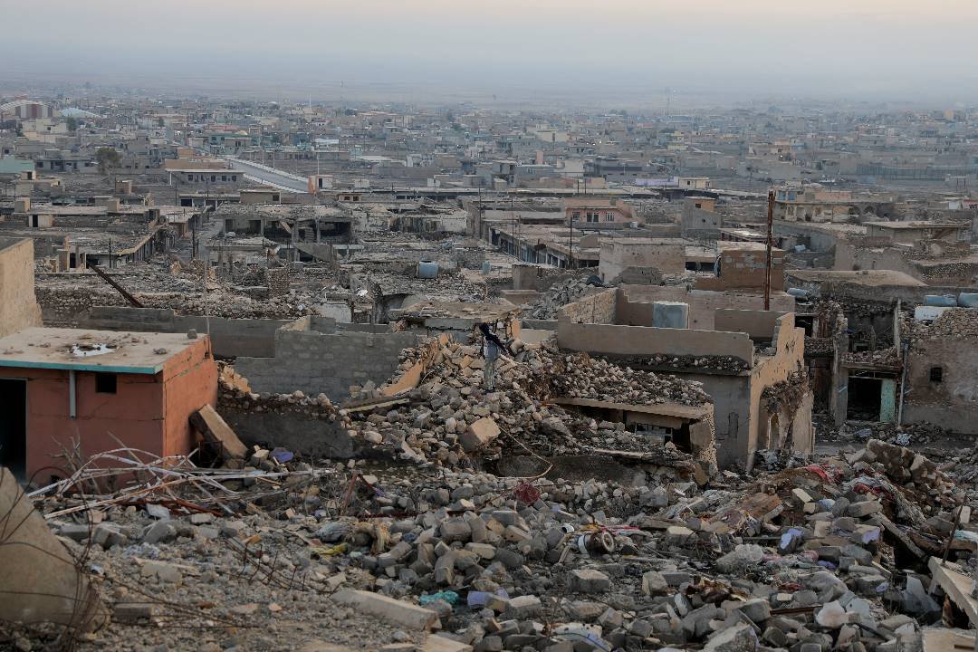 1月24日，伊拉克辛贾尔镇的房屋，在过去伊斯兰国激进分子的袭击中被毁。（图取自路透社）