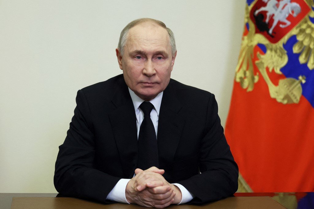 俄罗斯总统普京周六发表全国电视讲话，未有回应恐怖组织“伊斯兰国”承认发动袭击，却将矛头指向乌克兰。（图取自法新社）