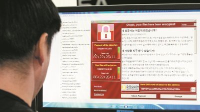 勒索软件“WannaCry”袭击全球电脑，引起恐慌，也在不断变种加强。-路透社/韩联社-