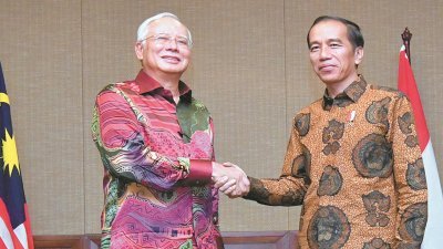 首相纳吉（左）与印尼总统佐科在第12次马印双边常年谘询会议中，在多项双边课题上达致共识。