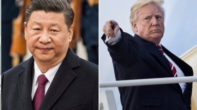 美国总统特朗普（右）下月展开亚洲行，其中一站为中国，届时将与中国国家主席习近平会面，而朝鲜半岛危机料是两国焦点之一。-法新社-