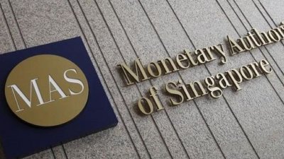 新加坡金融管理局针对时政新闻网站《States Times Review》一则有关一马发展公司弊案调查的报导，向警方投 报。 （图取自路透社）