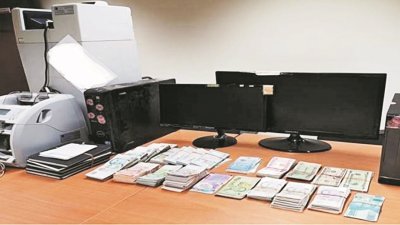 警方起获包括各国钞票、电脑器材、点钞机以及记事本等。（警方提供）