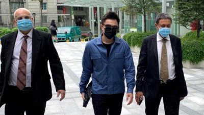 新加坡艺人包勋评(中)再犯，今早认罪后，被判坐牢5周。