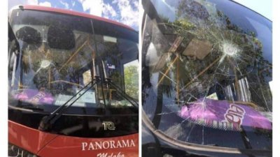 火爆的轿车司机砸坏全景巴士的挡风玻璃。