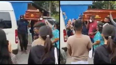 追思会结束后，纳加德兰灵柩被抬上灵车，准备运回怡保安葬。（视频截图）