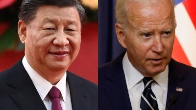 美国总统拜登（右）感染新冠肺炎，中国国家主席习近平致电慰问。（图取自路透社）