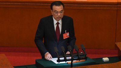中国全国人大会议周六开幕，总理李克强在会议上作政府工作报告。（图取自路透社）