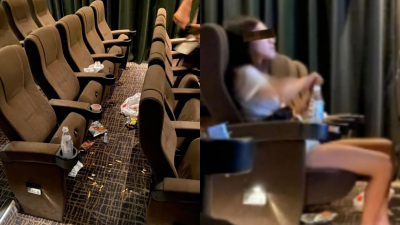 女子看完电影后，把食物和饮料包装袋留在座位和扔在地板上，现场一片狼藉。（取自面子书专页Complaint Singapore）