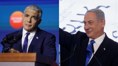 以色列看守总理拉皮德（左）祝贺当选总理内塔尼亚胡。（路透社）