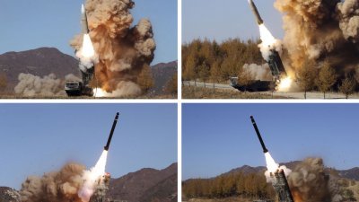 朝鲜官媒周一发布11月2日至5日拍摄的照片，显示朝鲜人民军在秘密地点进行各种导弹试射。（图取自朝中社/法新社）