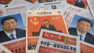 中国媒体周一头条都与习近平和全新的政治局常委人马有关。（图取自路透社）