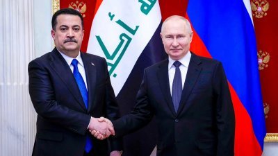 俄罗斯总统普京周二在莫斯科会晤到访的伊拉克总理苏达尼。（图取自伊拉克总理媒体办公室/路透社）