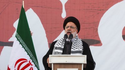 伊朗总统莱希10月18日出席在德黑兰举行的声援巴勒斯坦集会时讲话。（图取自WANA/路透社）