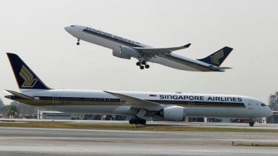 往返新加坡和吉隆坡的航线是全球最繁忙的航线之一，目前载客量只恢复到疫情前的85％。（路透社）