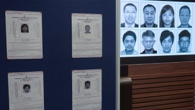 香港警方国安处宣布悬红通缉名单，被通缉的8名海外港人任建峰（第一排左起）、袁弓夷、郭凤仪、郭荣铿、许智峰（第二排左起）、蒙兆达、刘祖迪和罗冠聪。（图取自路透社）