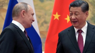 俄罗斯总统普京（左）和中国国家主席习近平。（图取自俄罗斯卫星通讯社/路透社）