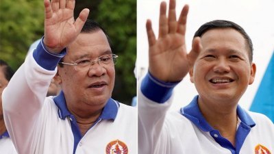 柬埔寨首相洪森（左）及其长子马内德。（图取自路透社）