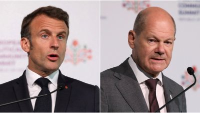 法国总统马克龙（左）和德国总理肖尔茨，当地时间周四在摩尔多瓦布尔博阿克，出席欧洲政治共同体（EPC）第2届峰会。（图取自路透社）