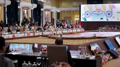 印度总理莫迪在G20外交部长会议开幕典礼上，呼吁20国集团消弭在乌克兰问题上的分歧。（图取自路透社）