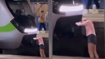 酒醉女子跌落月台轨道却趴在台铁区间车头上睡觉，引起争议。