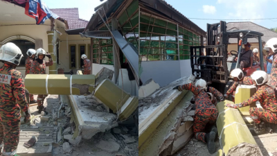 房梁倒塌导致两名印尼籍男子受困，其中一男子被困于塌陷的房梁下。