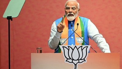 印度总理莫迪周日在新德里的印度人民党总部，发表该党的大选宣言。（图取自法新社）