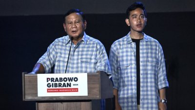 印尼国防部长普拉博沃（左）和副手吉布兰预料可以在首轮选举中胜出，当选印尼正副总统。（图取自法新社）
