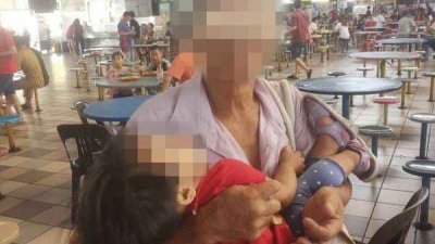 老翁抱著女童到峇央峇鲁小贩中心行乞，被民众误以为是拐带儿童。