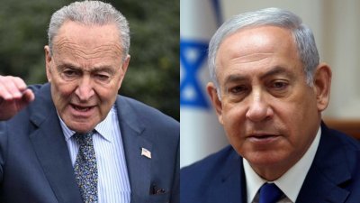 以色列总理内塔尼亚胡（右）表示，美国参议院多数党领袖舒默（左）敦促以色列举行新选举的演讲“完全不合适”。（图取自法新社）