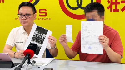 人联党公共投诉局主任符祥威（左）与受害者召开记者会。
