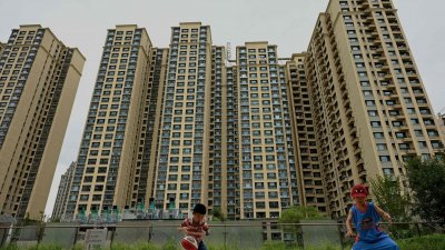 中国70个大中城市房价指数在9月按年下跌2.8%，跌幅持续收窄。（图取自法新社）